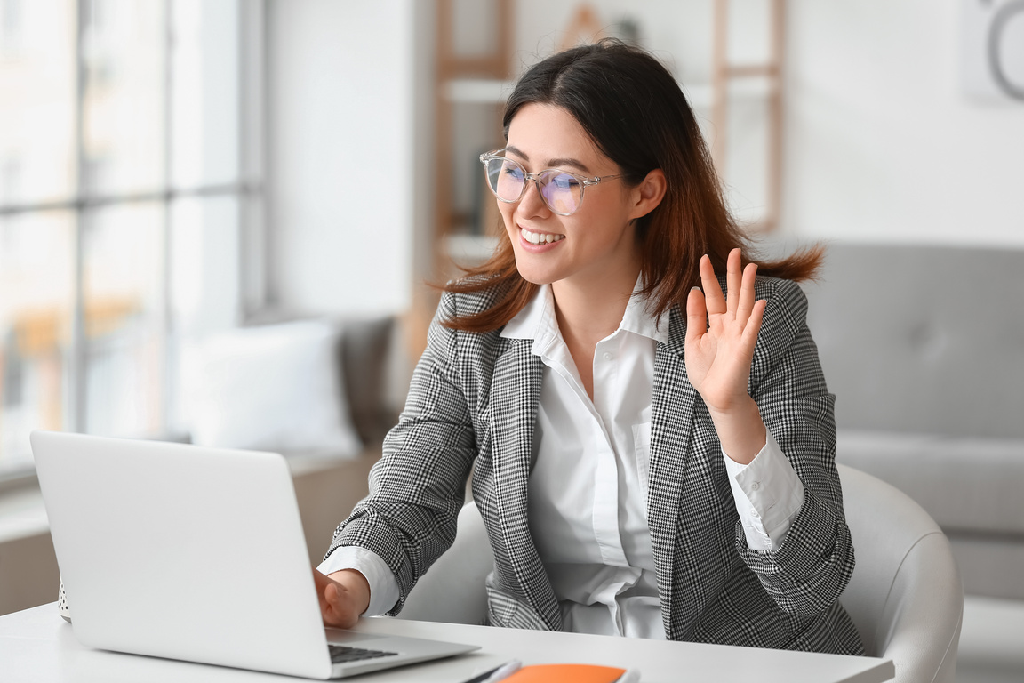 Young Woman Having Interview Online at Home